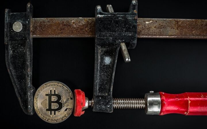 Bitcoin Slips Below $100K as Analysts Warn of Further Drop